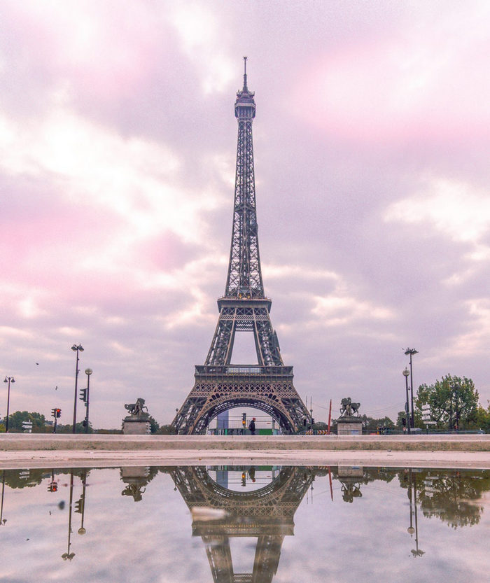 Eiffel Tower with a dramatic cloudy sky in the background