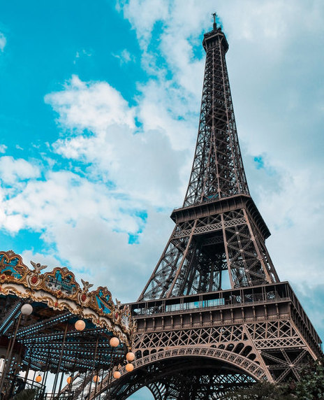 Eiffel Tower with a carousel in the foreground