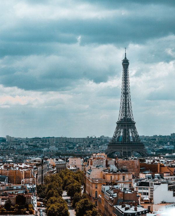 Eiffel Tower with cloudy sky in the background